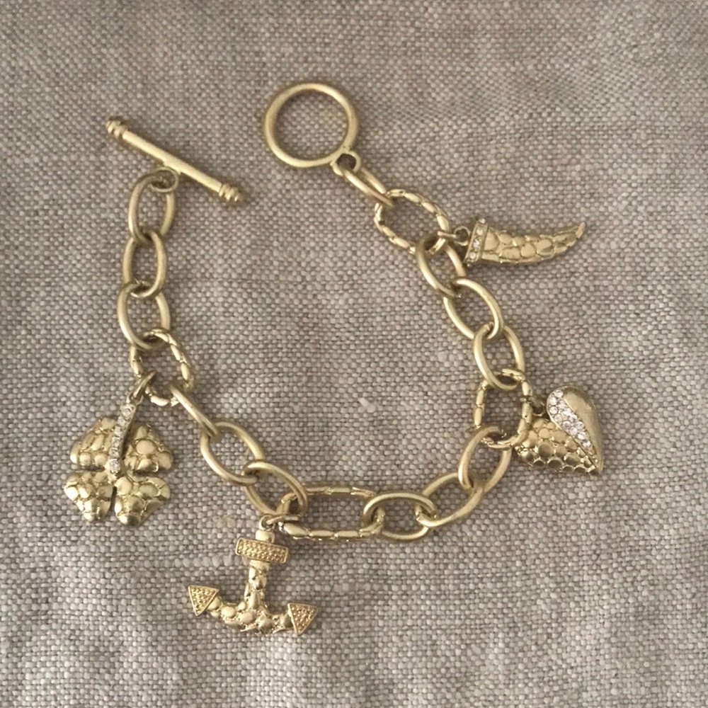 Gold tone charm bracelet.